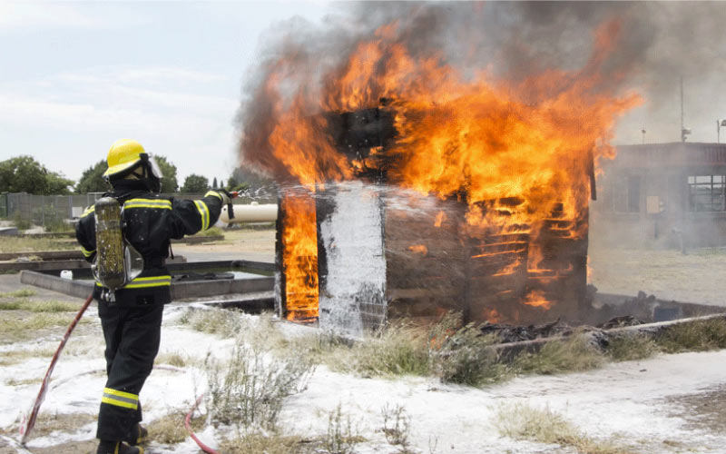 man demonstrating how to use a fire extinguisher, emergency training, October 2024, UK